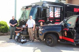 Delhi Fire Chief Ken Hall, right, and Deputy Chief Micah Duchesne display some of the new equipment recently funded by two AFG grants.